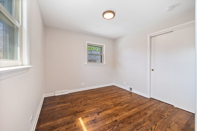 4850 N Clifton Ave, Norridge, IL 60706 - unfurnished bedroom featuring dark wood finished floors and a closet