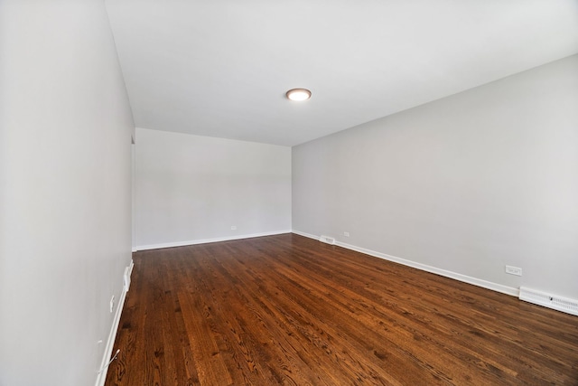 4850 N Clifton Ave, Norridge, IL 60706 - empty room with dark wood-type flooring and baseboards