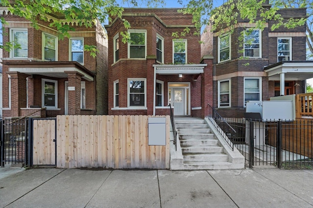 5726 S Elizabeth St, Chicago, IL 60636 - view of property featuring brick siding and a fenced front yard