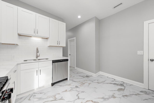 5726 S Elizabeth St, Chicago, IL 60636 - kitchen featuring appliances with stainless steel finishes, light marble finish flooring, recessed lighting, decorative backsplash, and white cabinets