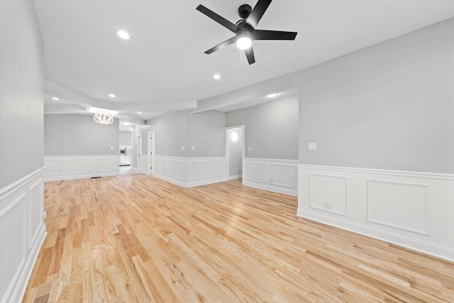 5726 S Elizabeth St, Chicago, IL 60636 - unfurnished room with a decorative wall, wainscoting, a ceiling fan, recessed lighting, and light wood-style floors