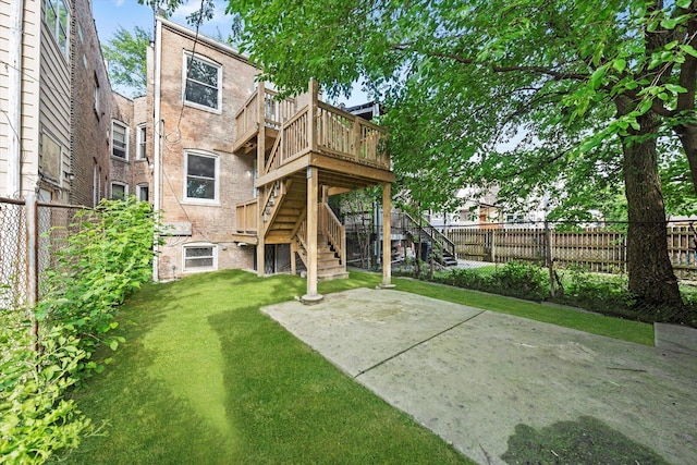 5726 S Elizabeth St, Chicago, IL 60636 - back of property with stairs, a fenced backyard, a deck, and a patio area
