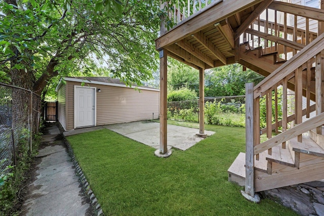 5726 S Elizabeth St, Chicago, IL 60636 - fenced backyard with stairway, a patio, and an outdoor structure