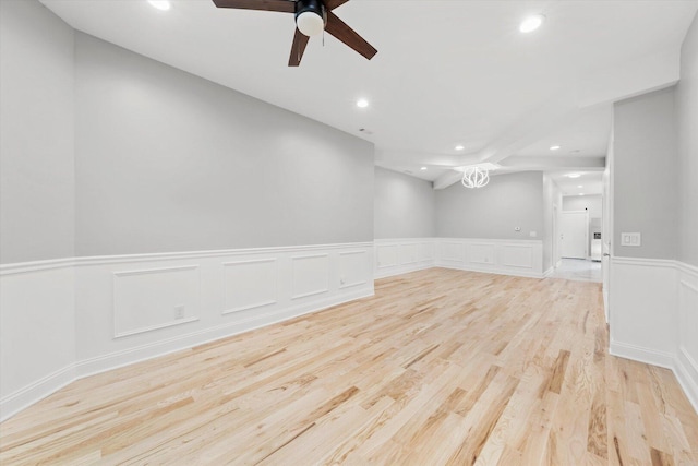 5726 S Elizabeth St, Chicago, IL 60636 - spare room with recessed lighting, wainscoting, light wood finished floors, ceiling fan, and a decorative wall