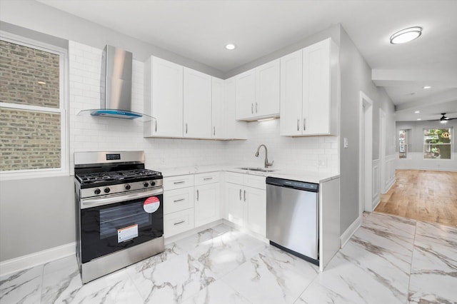 5726 S Elizabeth St, Chicago, IL 60636 - kitchen featuring stainless steel appliances, wall chimney range hood, light countertops, light marble finish floors, and recessed lighting