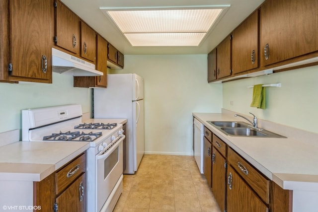 1335 Chelsea Cv, Roselle, IL 60172 - kitchen with white appliances, under cabinet range hood, light countertops, and light tile patterned floors