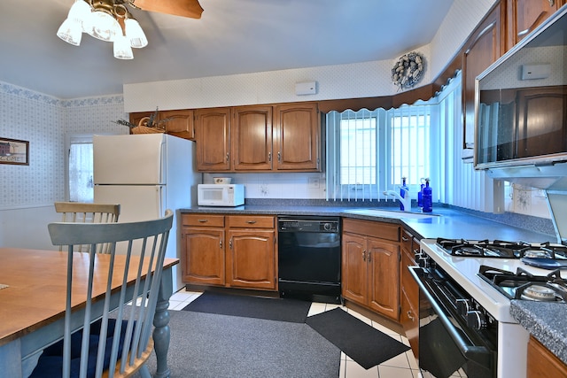 8532 N Olcott Ave, Niles, IL 60714 - kitchen with wallpapered walls, white appliances, brown cabinets, a ceiling fan, and dark countertops