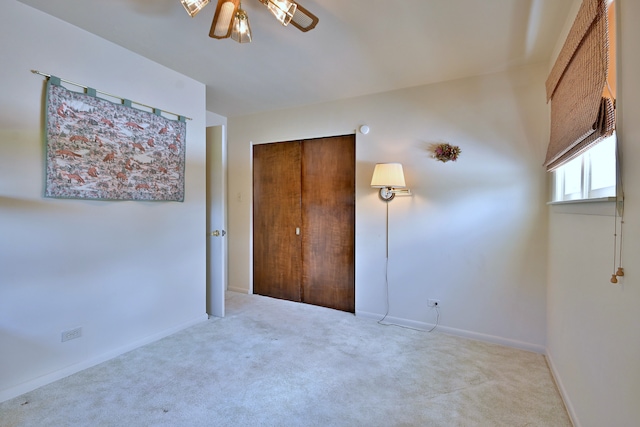 8532 N Olcott Ave, Niles, IL 60714 - unfurnished bedroom featuring carpet flooring, a closet, and ceiling fan