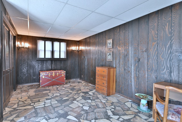 8532 N Olcott Ave, Niles, IL 60714 - spare room with a paneled ceiling and wood walls