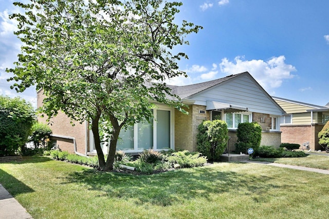 8532 N Olcott Ave, Niles, IL 60714 - view of front of home featuring brick siding and a front lawn