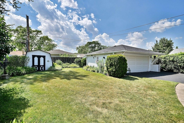 8532 N Olcott Ave, Niles, IL 60714 - view of yard featuring a garage and a storage unit