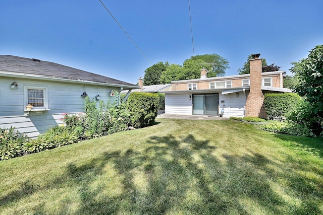 8532 N Olcott Ave, Niles, IL 60714 - back of house with a yard