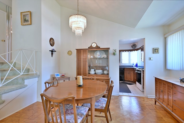 8532 N Olcott Ave, Niles, IL 60714 - dining area featuring a chandelier and high vaulted ceiling