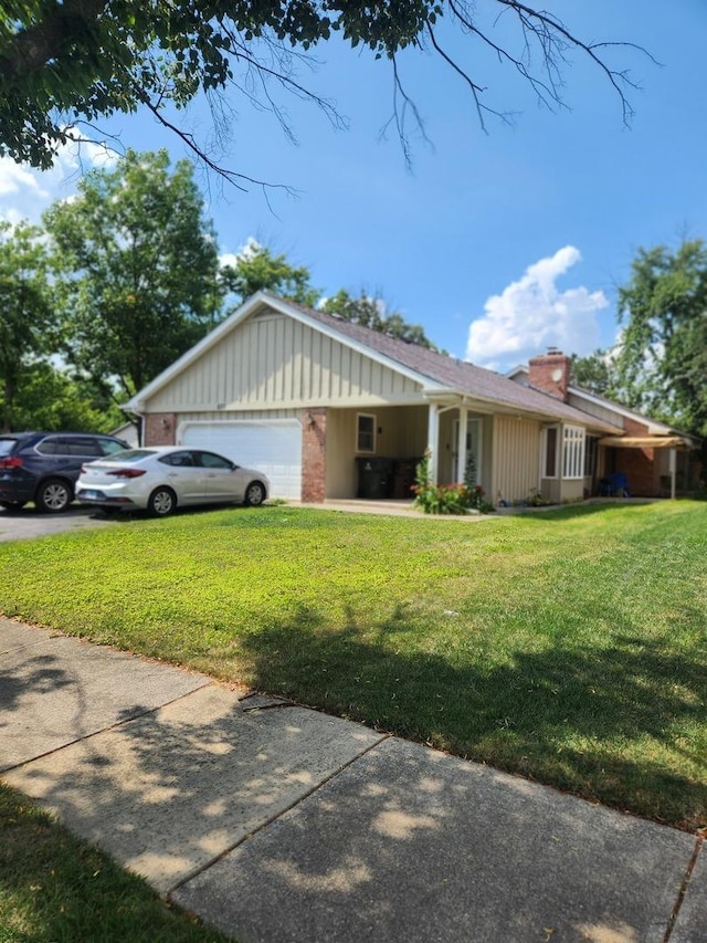 837 Hamlin Ave, Flossmoor, IL 60422 - view of side of home with a yard, an attached garage, a chimney, board and batten siding, and driveway