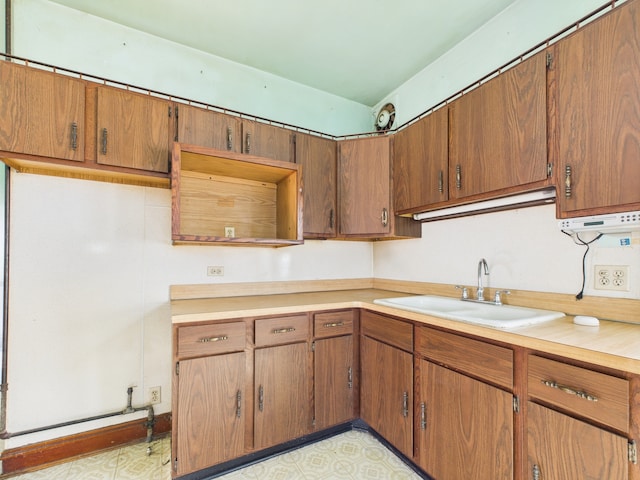 3109 W 53rd Pl, Chicago, IL 60632 - kitchen with light countertops, brown cabinets, and light flooring