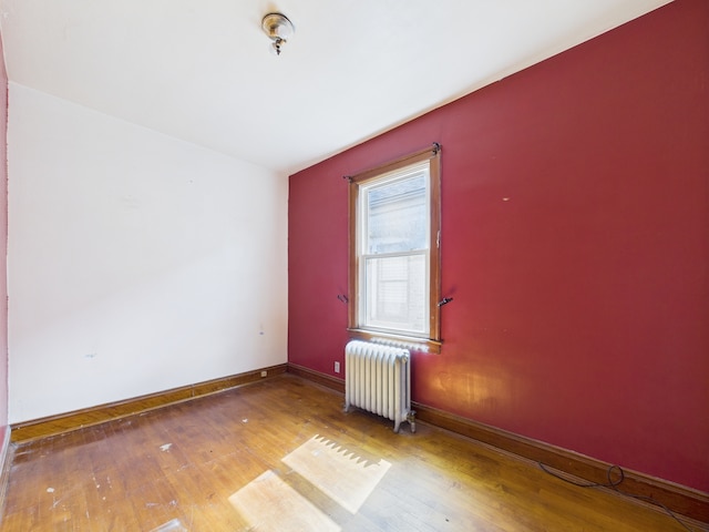3109 W 53rd Pl, Chicago, IL 60632 - unfurnished room with radiator and hardwood / wood-style flooring