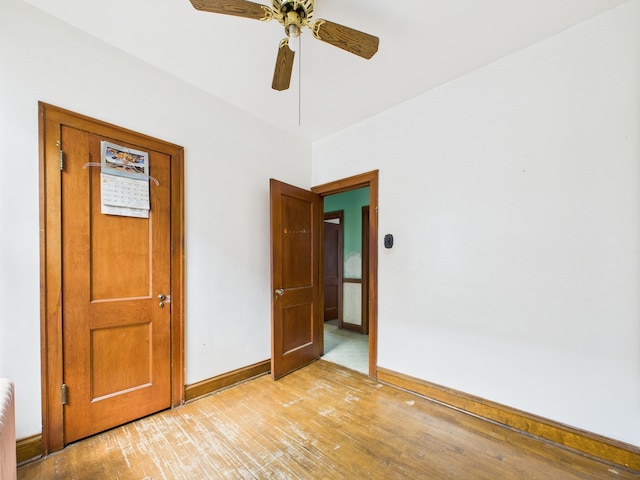 3109 W 53rd Pl, Chicago, IL 60632 - empty room with light wood-type flooring, a ceiling fan, and radiator heating unit