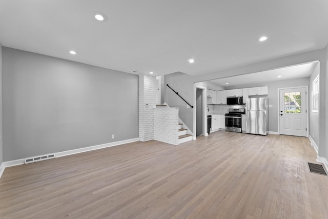 4025 Williams St, Downers Grove, IL 60515 - unfurnished living room with stairway, recessed lighting, and light wood-style flooring