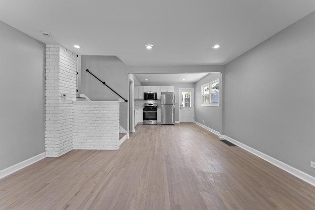 4025 Williams St, Downers Grove, IL 60515 - unfurnished living room with light wood-style flooring and recessed lighting