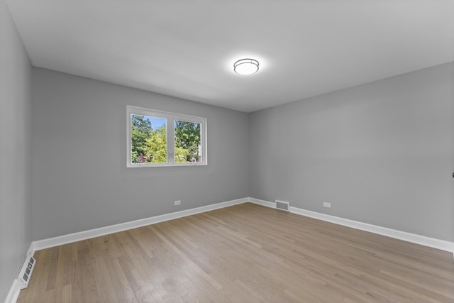4025 Williams St, Downers Grove, IL 60515 - unfurnished room with baseboards and light wood finished floors