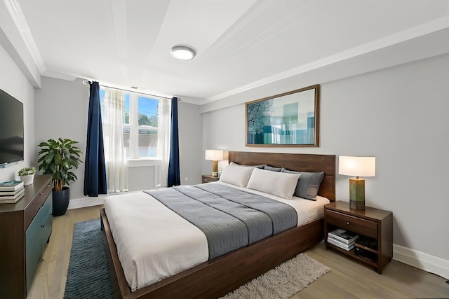 2501 W Touhy Ave Unit 105, Chicago, IL 60645 - bedroom featuring crown molding and light wood-style flooring