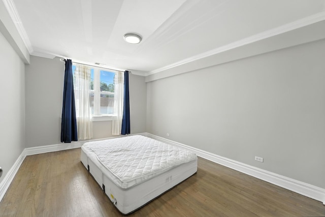 2501 W Touhy Ave Unit 105, Chicago, IL 60645 - bedroom featuring ornamental molding and wood finished floors