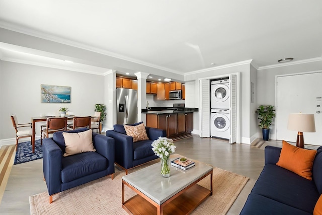 2501 W Touhy Ave Unit 105, Chicago, IL 60645 - living room featuring stacked washing machine and dryer, crown molding, decorative columns, and recessed lighting