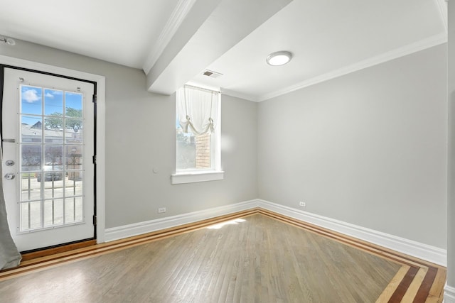 2501 W Touhy Ave Unit 105, Chicago, IL 60645 - spare room with crown molding and wood finished floors