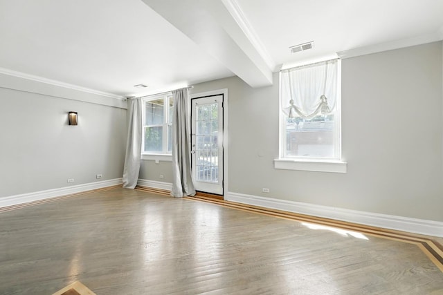 2501 W Touhy Ave Unit 105, Chicago, IL 60645 - unfurnished room with ornamental molding and wood finished floors