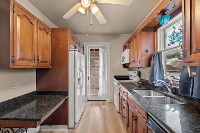 6510 Sinclair Ave, Berwyn, IL 60402 - kitchen with white appliances, brown cabinets, dark stone counters, a ceiling fan, and light wood-style flooring