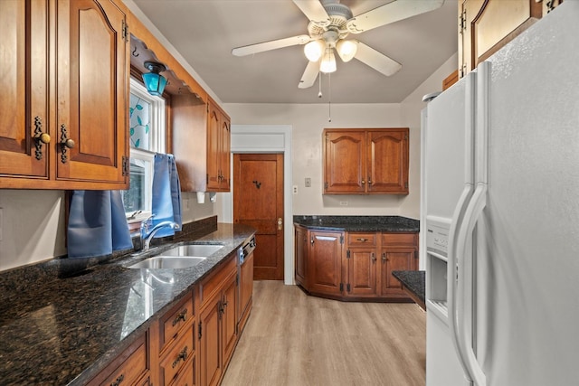 6510 Sinclair Ave, Berwyn, IL 60402 - kitchen with white fridge with ice dispenser, light wood finished floors, brown cabinetry, and ceiling fan