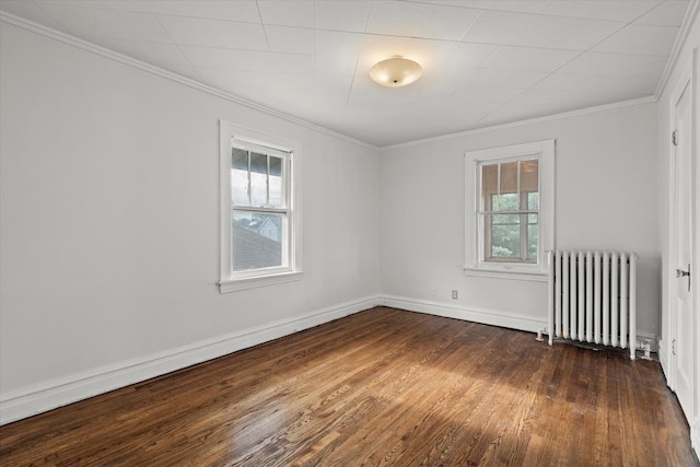 6510 Sinclair Ave, Berwyn, IL 60402 - empty room featuring radiator heating unit, healthy amount of natural light, dark wood-type flooring, and crown molding