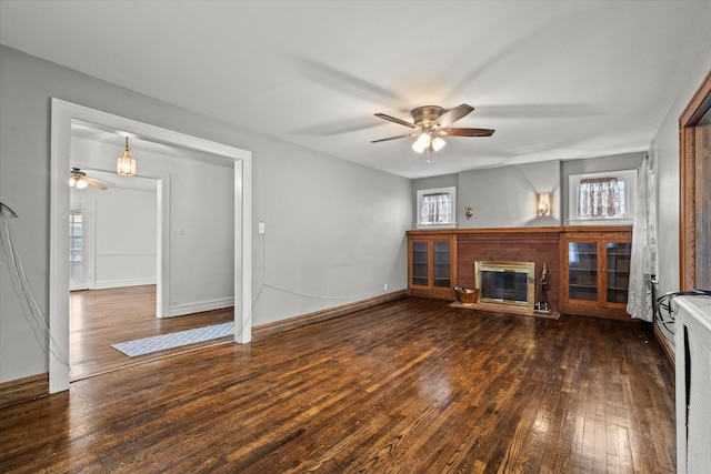 6510 Sinclair Ave, Berwyn, IL 60402 - unfurnished living room with a ceiling fan, hardwood / wood-style flooring, and a brick fireplace