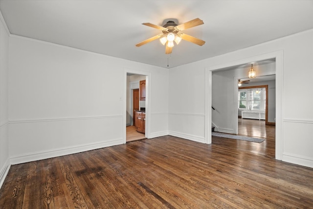 6510 Sinclair Ave, Berwyn, IL 60402 - spare room with dark wood-type flooring, ceiling fan, ornamental molding, and stairs