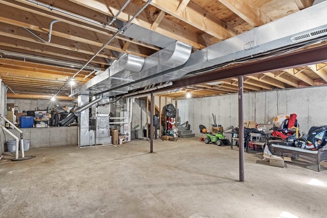 18140 Crystal Ln, Lansing, IL 60438 - unfinished below grade area featuring heating unit and drainage system