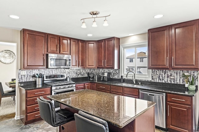 18140 Crystal Ln, Lansing, IL 60438 - kitchen with stainless steel appliances, tasteful backsplash, a kitchen bar, a kitchen island, and recessed lighting