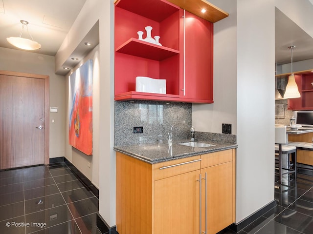 333 W Hubbard St Unit 1006, Chicago, IL 60654 - kitchen featuring tasteful backsplash, open shelves, dark stone countertops, and dark tile patterned flooring