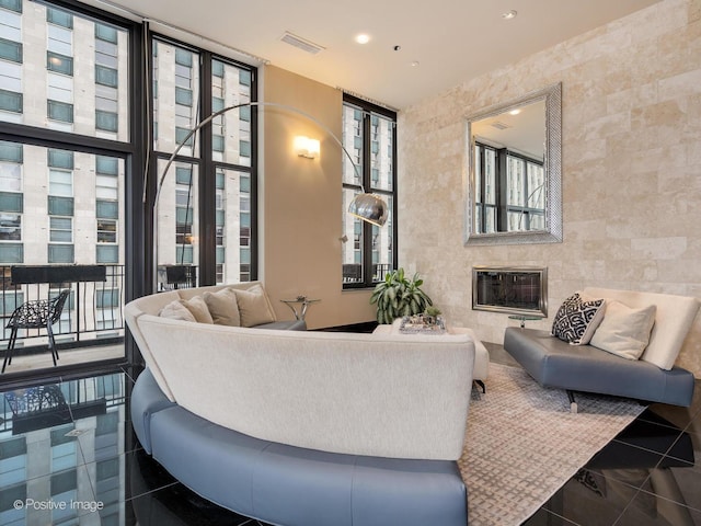 333 W Hubbard St Unit 1006, Chicago, IL 60654 - living room with a wall of windows, a fireplace, and recessed lighting
