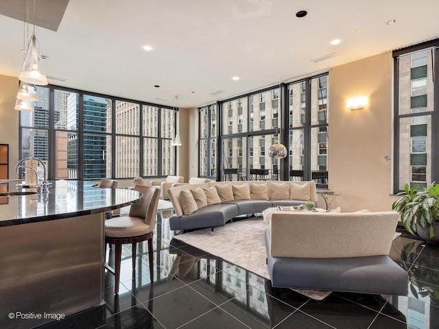 333 W Hubbard St Unit 1006, Chicago, IL 60654 - living room featuring floor to ceiling windows, dark tile patterned floors, and recessed lighting