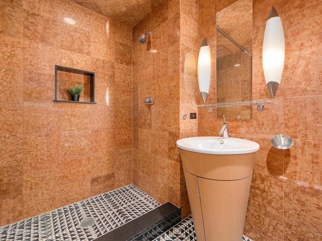 333 W Hubbard St Unit 1006, Chicago, IL 60654 - bathroom with tiled shower, tile walls, and vanity