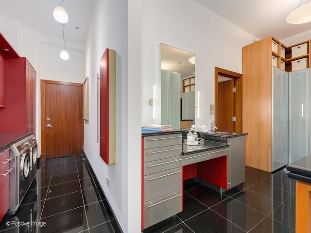333 W Hubbard St Unit 1006, Chicago, IL 60654 - bathroom featuring stacked washer / drying machine, a high ceiling, and vanity