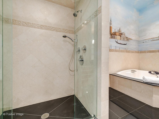 333 W Hubbard St Unit 1006, Chicago, IL 60654 - bathroom with a shower stall, a garden tub, and tile walls