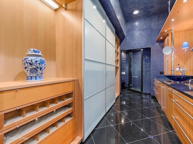 333 W Hubbard St Unit 1006, Chicago, IL 60654 - interior space featuring granite tiled floors, vanity, and recessed lighting