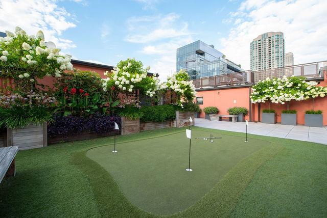333 W Hubbard St Unit 1006, Chicago, IL 60654 - view of home's community featuring an area to practice putting, a view of city, and a patio