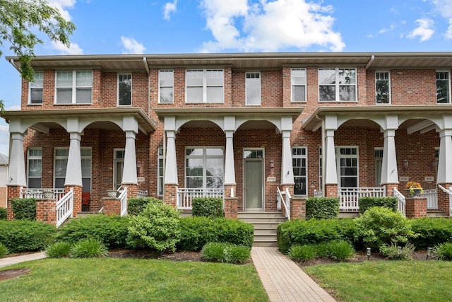 6112 Ironwood Ln, Lisle, IL 60532 - townhome / multi-family property with covered porch, brick siding, and a front lawn