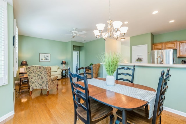 11397 Stonewater Xing, Huntley, IL 60142 - dining area with light wood-style flooring, a ceiling fan, recessed lighting, and a chandelier