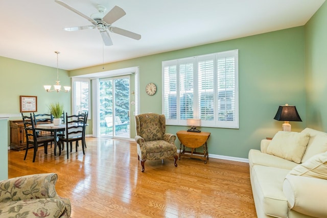 11397 Stonewater Xing, Huntley, IL 60142 - living room featuring a chandelier, light wood-style flooring, and ceiling fan