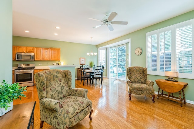 11397 Stonewater Xing, Huntley, IL 60142 - living room featuring a chandelier, light wood-type flooring, recessed lighting, and ceiling fan