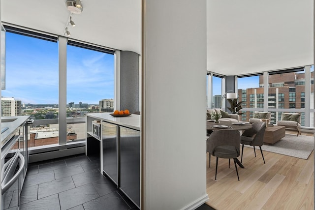 1300 N Astor St Unit 26C, Chicago, IL 60610 - dining space with a view of city, expansive windows, and healthy amount of natural light