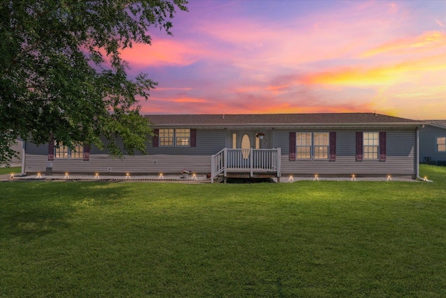 510 W Rhodes St, Thomasboro, IL 61878 - back of house at dusk with a lawn